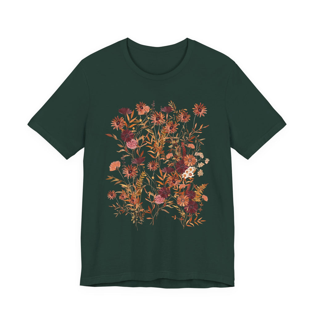 A dark forest green short-sleeve crewneck t-shirt featuring a large, colorful floral graphic on the front